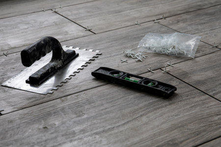 Spirit level and tiling tools. Repairs and renovation