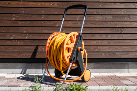 Garden hose for watering plants and flowers. Gardening equipmentの写真素材