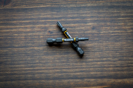 Makita Impact Premier Double Torsion Bit T20. Wood texture background
