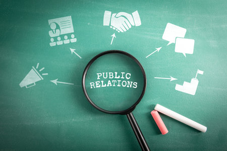 Public Relations. Magnifying glass on green school blackboard backgroundの写真素材
