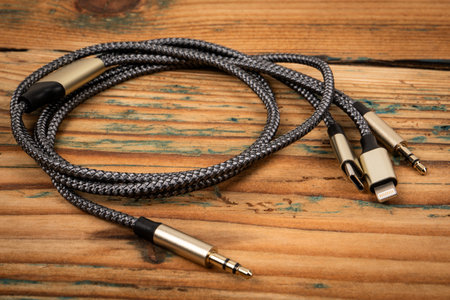 3 In 1 Type-C3.5mm Jack Aux Cable on a wooden texture background. Object