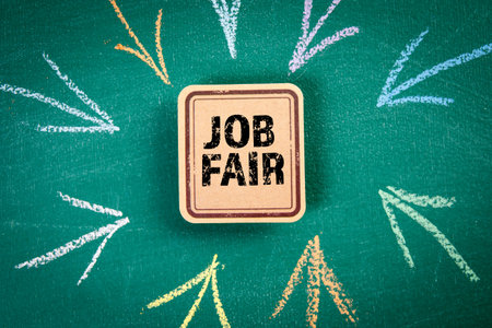 Job Fair. Cardboard sticky note with text on a green chalkboard background