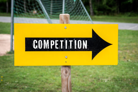 Competition. Direction arrow with text on sports fieldの写真素材