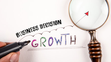 Business Decision Concept. Magnifying glass and growth arrow on white backgroundの写真素材