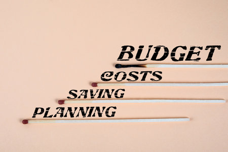 Budget Concept. Matches on a light backgroundの写真素材