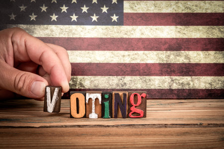 Colorful letters of the alphabet on a wooden texture tableの写真素材