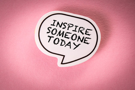 Inspire Someone Today. Speech bubble with text on pink backgroundの写真素材