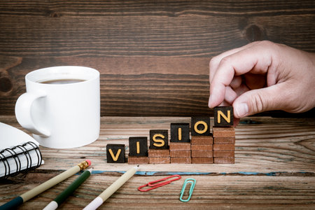 VISION. Old letter tiles on wooden steps, development conceptの写真素材