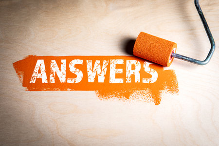 Answers. Orange paint and paint roller on wood texture backgroundの写真素材