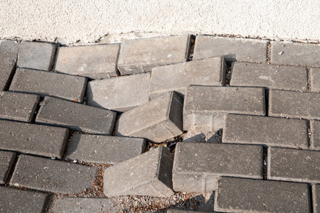 Collapsed pavement on the sidewalk, worn out road structuresの写真素材