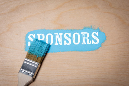 Sponsors. Blue paint and paint brush on wooden texture backgroundの写真素材