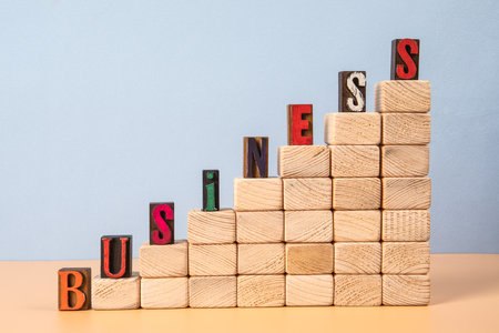 BUSINESS. Wooden blocks and the alphabet. Development conceptの写真素材