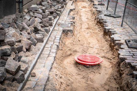 Street repairs in the old town. Replacement of water pipes and paving
