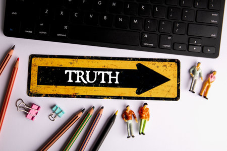 TRUTH Concept. Direction arrow with text on white office tableの写真素材