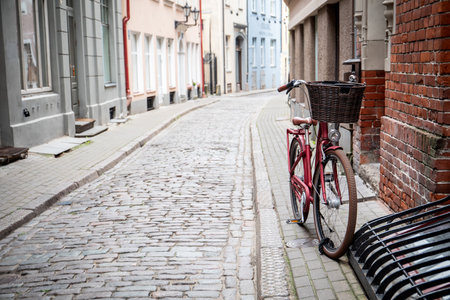 Bicycle parked on the street with a basket on the frontの写真素材
