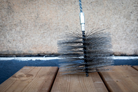 Close up of a metal steel wire brush for cleaning heaters and fireplaces. chimney sweepersの写真素材