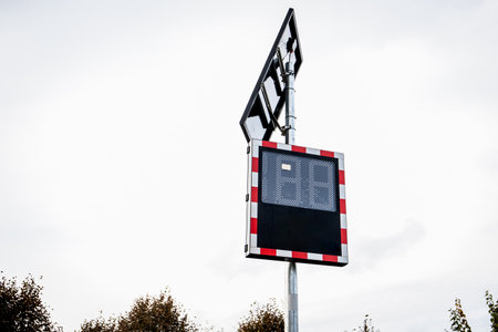 Speed limit zone and radar speed indicator sign on a street