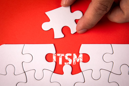 ITSM - Information Technology Service Management. White puzzle pieces on an red backgroundの写真素材