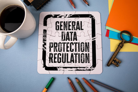 General Data Protection Regulation. White puzzle and office supplies on tableの写真素材