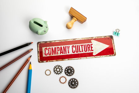 Company Culture. Red direction arrow with text on white office deskの写真素材