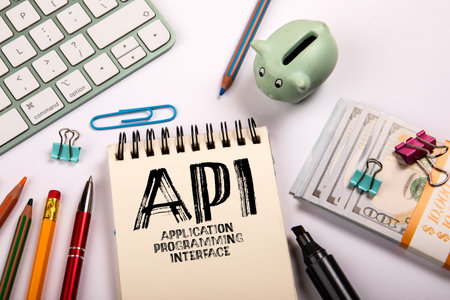 API Application Programming Interface. Stationery on a white office desk