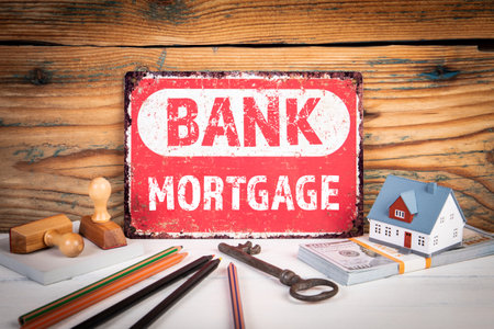 Mortgage Concept. Metal sign with text on wooden office tableの写真素材