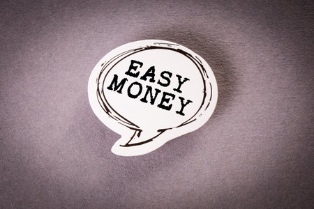 Speech bubble with text on a gray backgroundの写真素材