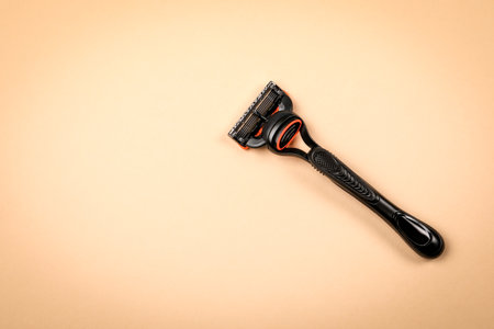 Shaving razor on a light background with free space for textの写真素材