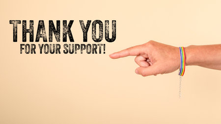 Thank You for your Support. Hand with Rainbow Bracelet Pointing on Message, Neutral Background