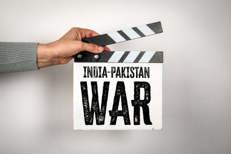 India-Pakistan War Concept on Film Clapperboard Held by Hand