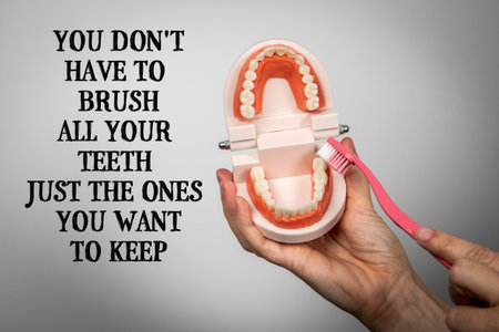 You Dont Have To Brush All Your Teeth Just The Ones You Want To Keep. Toothbrush and Denture Model...