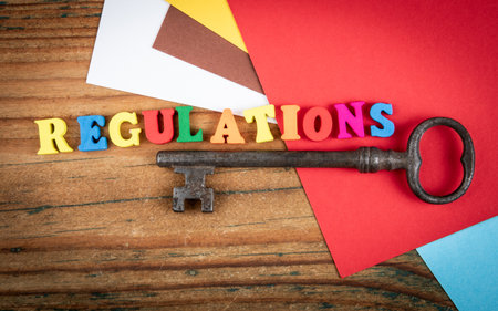 Regulations Concept with Colorful Letters and Vintage Keyの写真素材