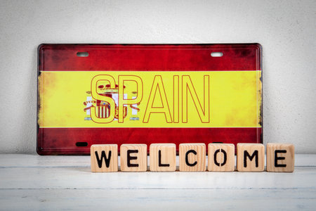 Welcome to Spain Message with Wooden Blocks and Spanish Flagの写真素材