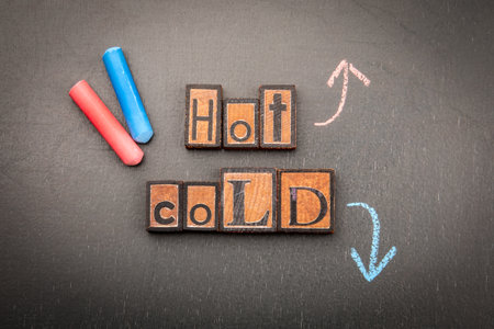 Hot and cold contrast concept with chalk arrows and blocksの写真素材