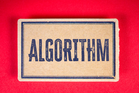 Algorithm concept with vintage style cardboard sign on red backgroundの写真素材