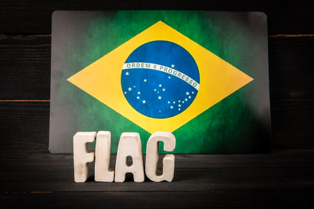 Brazilian flag with bold text word flag in front, symbolizing national pride, culture, identity, and representationの写真素材