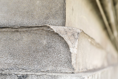 Peeling Paint and Cracked Wall Texture Detail. Decay and weathered architectural materialの写真素材