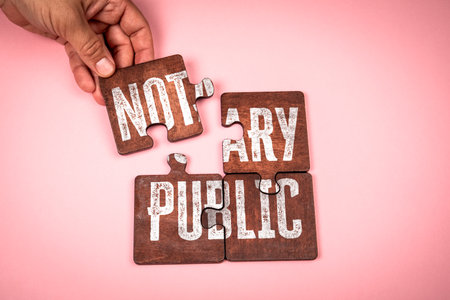 Hand Assembling Wooden Puzzle Pieces with Text Notary Public Representing Legal Certification and...