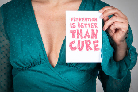 Person Holding Card with Message Prevention Is Better Than Cure Representing Health Awareness and Wellness Conceptの写真素材