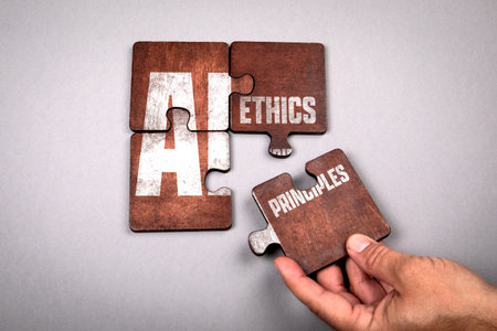 Hand Assembling Puzzle Pieces with Words AI Ethics and Principles Representing Artificial Intelligence Responsibilityの写真素材
