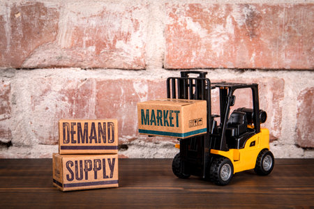 Forklift Lifting Market Box Near Demand and Supply Box Representing Business and Economy Conceptの写真素材