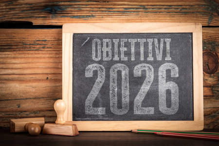 2026 Goals Written in Italian on Rustic Chalkboard Workspace