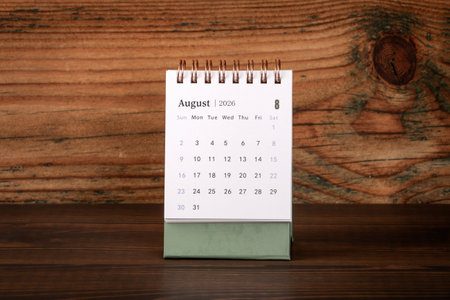 August 2026 Desk Calendar on Wooden Background Surfaceの写真素材