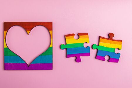 mock-up LGBT symbolism in the form of a rainbow two puzzle and heart frame. A place for photography...