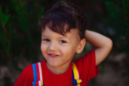 portrait of a laughing child against the background of natureの写真素材