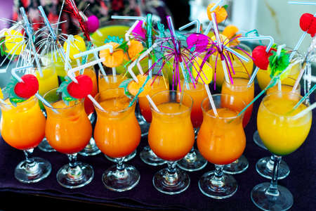 The tray with non-alcoholic cocktails of bright orange and yellow color in the hotel is all included on the Turkish coast. Rest and drinks in the restaurant. partyの写真素材
