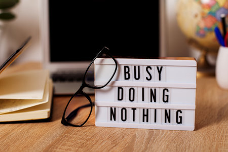 a message in the workplace. on the desktop near the computer and glasses lightbox with the...