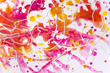 texture of acrylic paints on canvas in red and white. blurred background, brush texture in paints on...