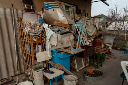 trash and garbage are collected against the wall