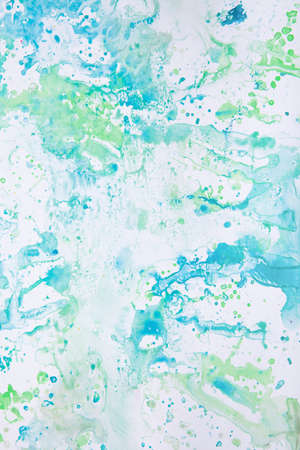 watercolor spots of yellow and blue on a white background. texture. bright spots and splashes of...